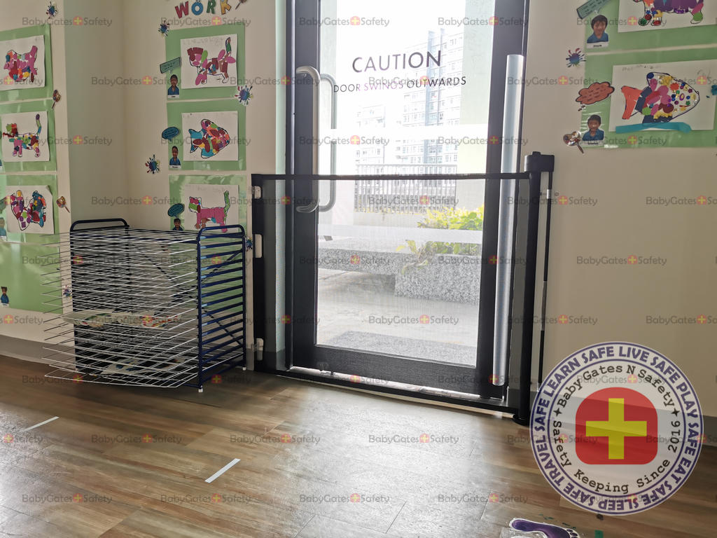 Retractable gate at childcare entrance